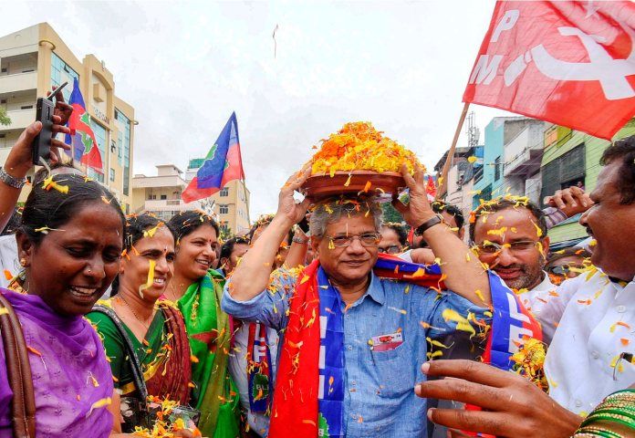 A dyspeptic looking Yechury carrying the kalash on his head
