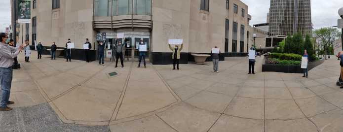 Residents of Twin cities protesting in front of City Hall