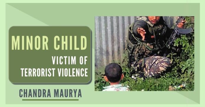 For several minutes, a three-year-old minor child was seen making efforts, sitting over the bullet-ridden dead body of his maternal grandparent, to wake him up. Soon after spotting him, SHO of Sopore rushed towards him and escorted him to safety