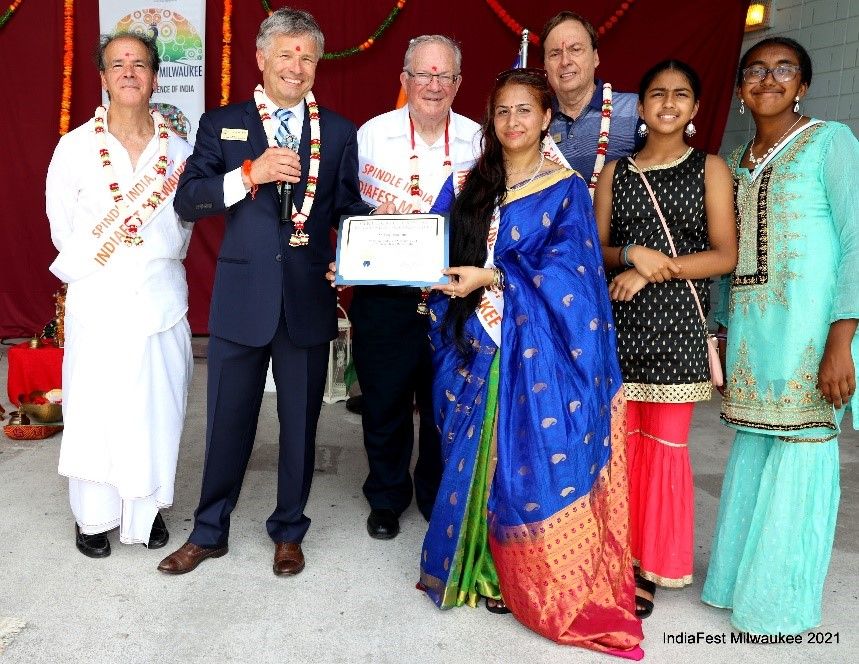 Paul Truess presenting Certificate of Special Senatorial Recognition to Purnima Nath. From Left to right - Joseph Scala, Paul Truess – Regional Director Office of US Senator Ron Johnson, Steve Ponto – Mayor Brookfield, Purnima Nath – Founder, Chairwoman & President Spindle India, Inc., Bob Spindell – Chair, RPW Congressional District 4 Chair, Megha/Neha Patil – Youth Volunteers.