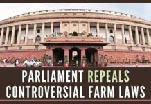 Parliament passes a bill to cancel the controversial laws that led to yearlong agitation by tens of thousands of farmers